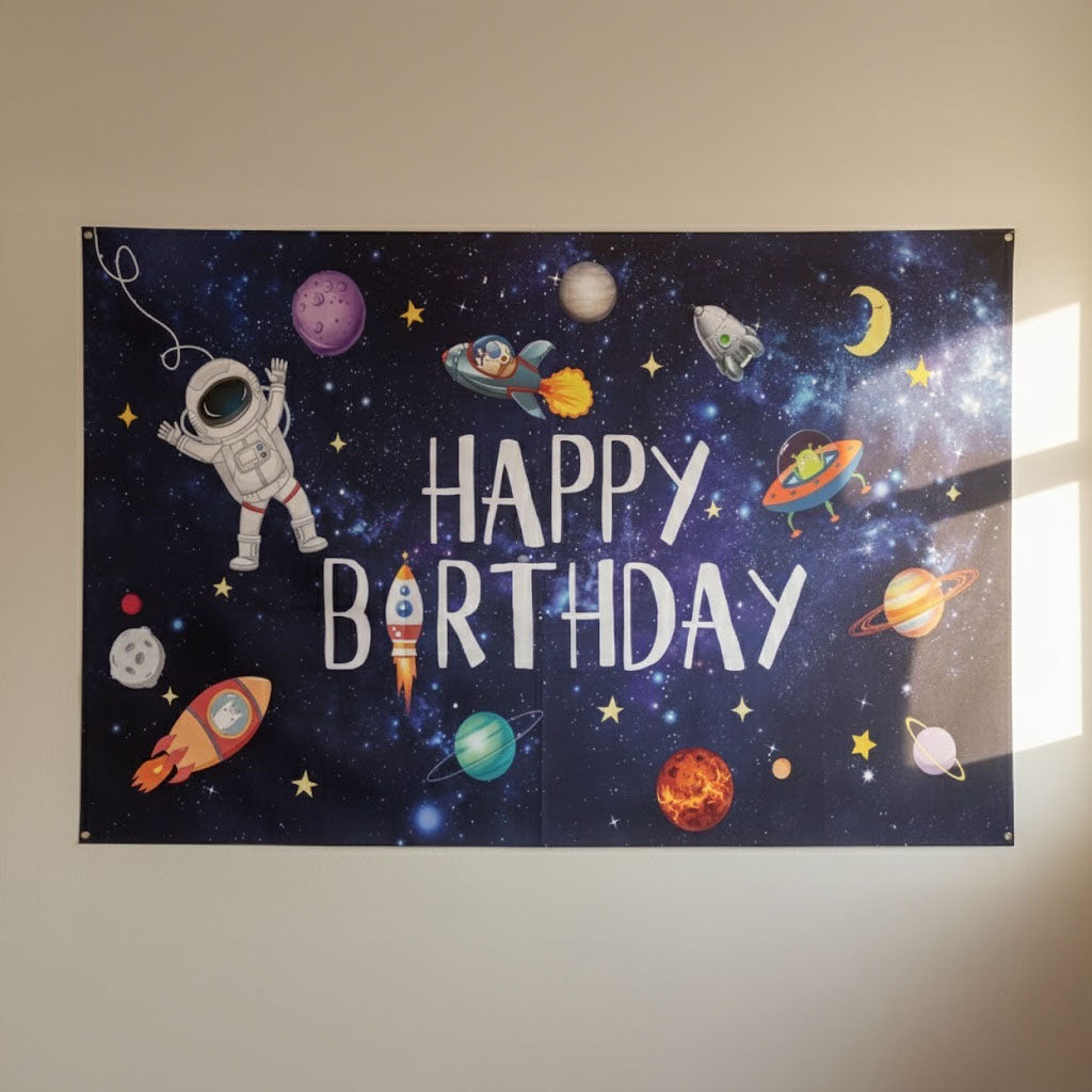 Space-themed birthday banner with planets, stars, and an astronaut.