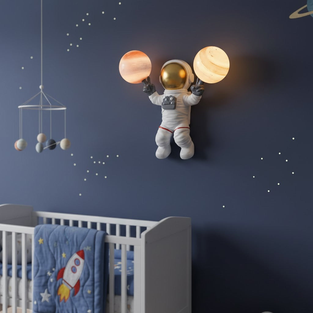 Astronaut wall light fixture in a child's bedroom with a crib and space-themed decor.
