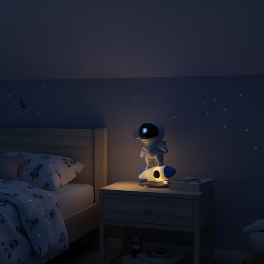 Children's bedroom with an astronaut night light on a bedside table