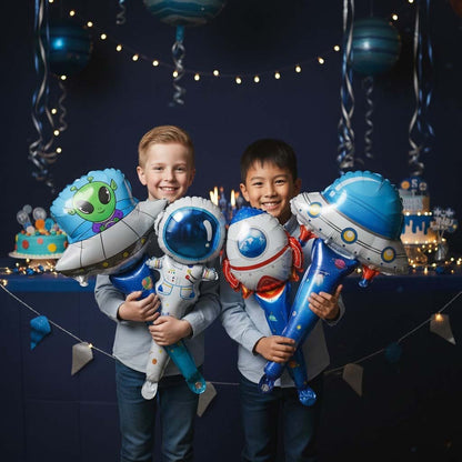 Two children holding space-themed balloons in a festive setting with decorations.
