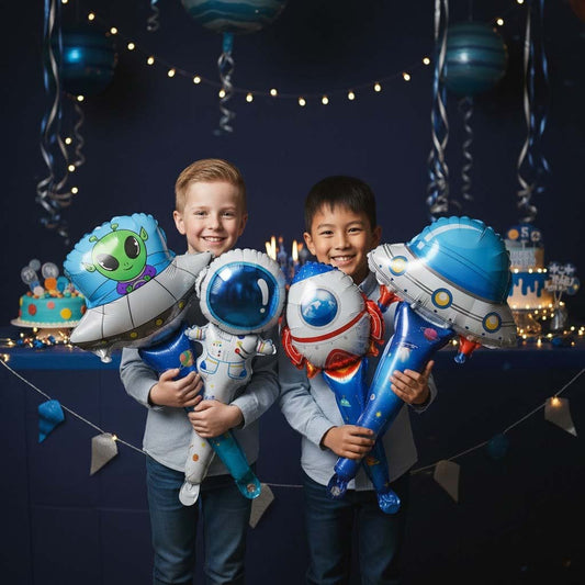 Two children holding space-themed balloons in a festive setting with decorations.