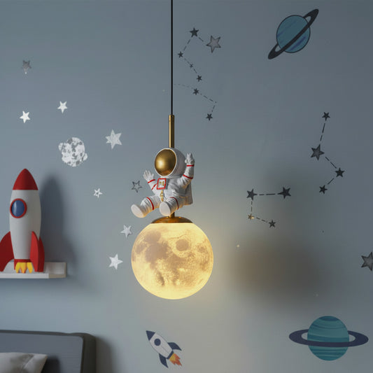 Children's room with astronaut and moon decoration on a gray wall.