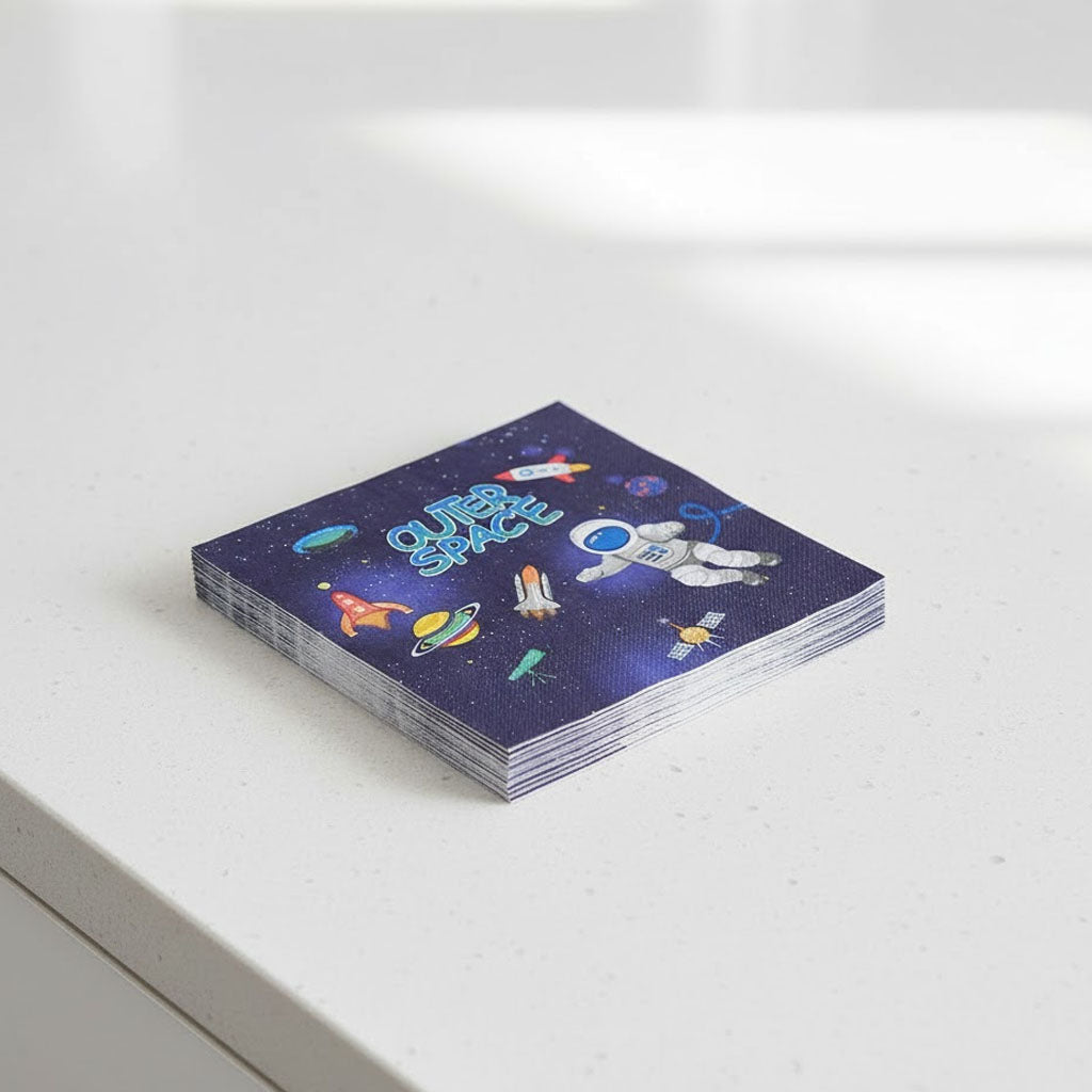 Stack of space-themed napkins on a white surface