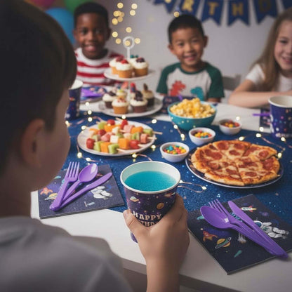 Children at a birthday party with delicious looking food and colorful plates, napkins and cutlery.