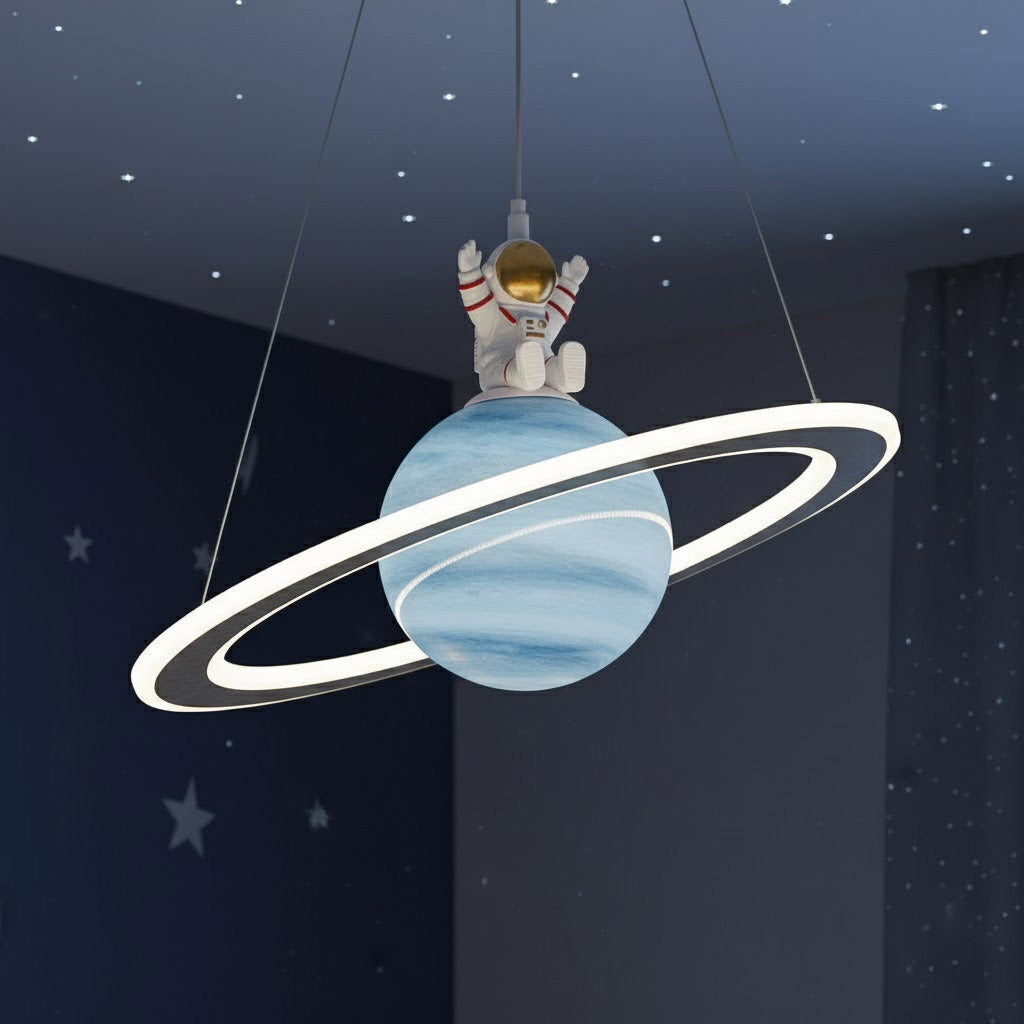 Ceiling light fixture designed like a planet with an astronaut figure, set against a starry night sky.