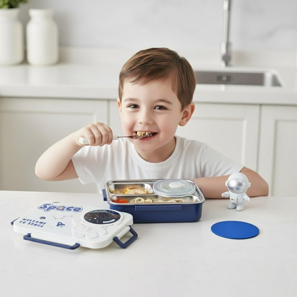 Child eating from a space themed lunchbox in a kitchen setting