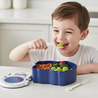 Child eating from a blue compartmentalised lunch box with a white background