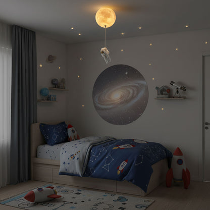 Children's bedroom with space-themed decor, including a bed with rocket designs, a planet wall mural, and a moon light fixture.